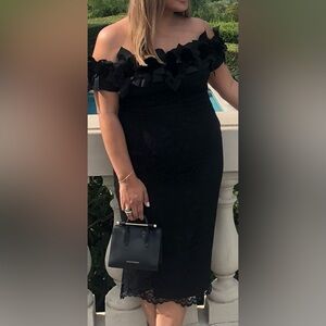 Stunning off shoulder lace dress with flower detail